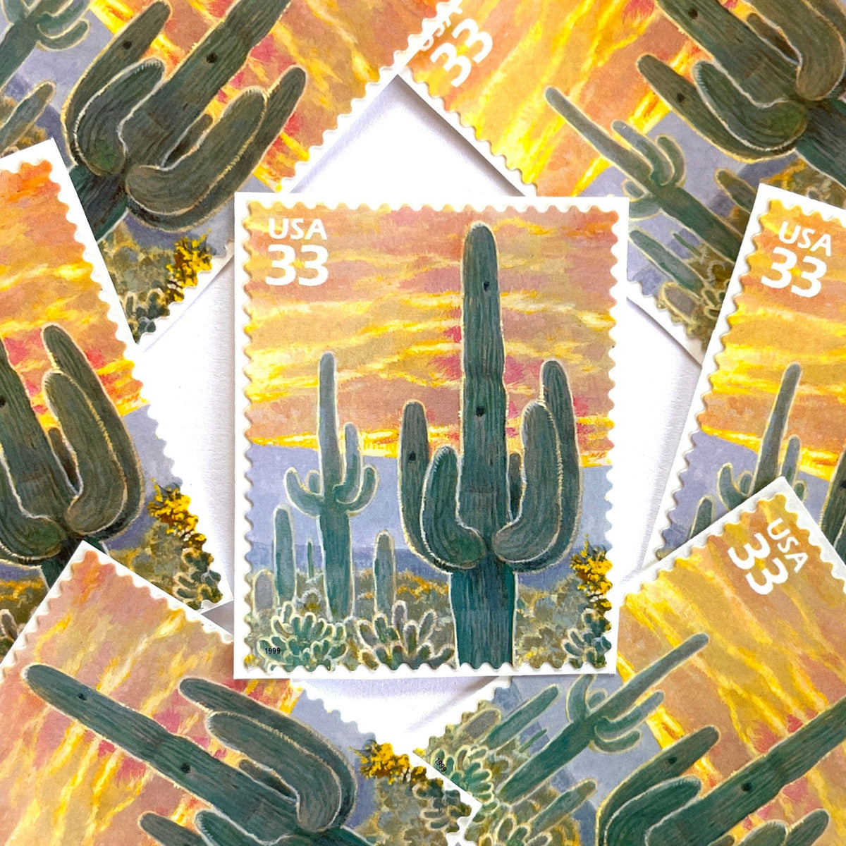 Image of Saguaro Cactus postage stamps from the 1999 Nature of America Sonoran Desert series, featuring a green saguaro cactus in a Southwestern desert landscape on vintage unused 33-cent USPS postage, Scott 3293e.