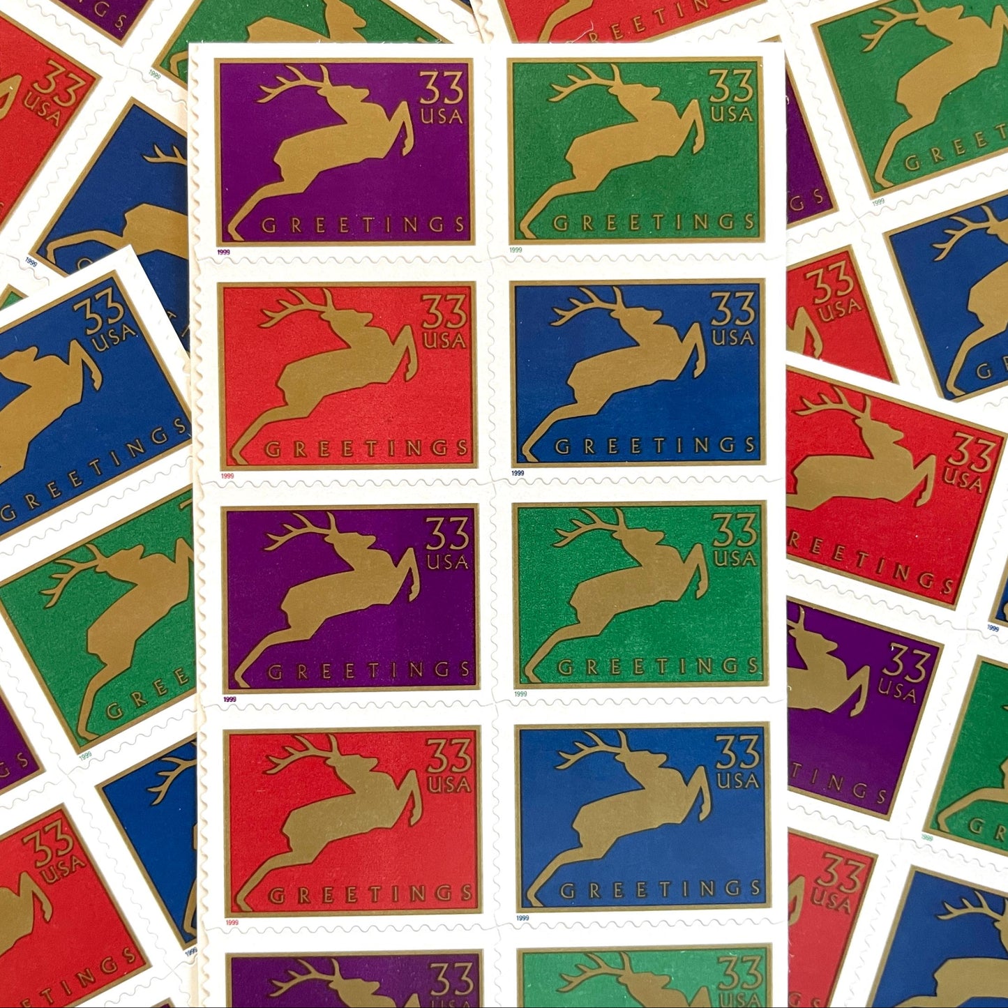 Image of 1999 Contemporary Christmas “Reindeer” 33-cent stamps. Scott #3360-63. Stamp Themes: Christmas, Holidays, Reindeer, Jumping Deer, Antlers, Greetings. Multicolored postage stamps.