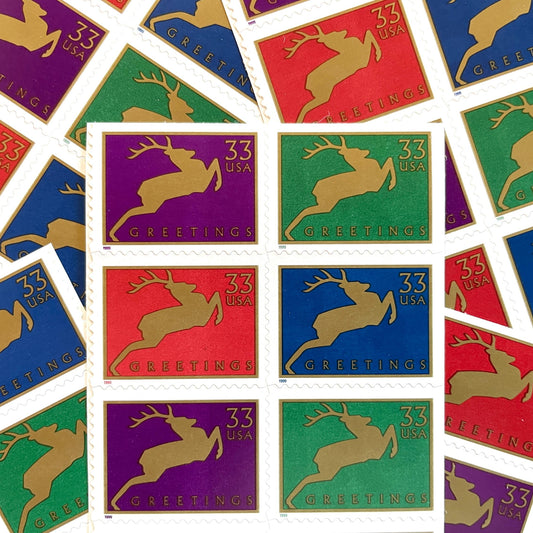 Image of 1999 Contemporary Christmas “Reindeer” 33-cent stamps. Scott #3360-63. Stamp Themes: Christmas, Holidays, Reindeer, Jumping Deer, Antlers, Greetings. Multicolored postage stamps.