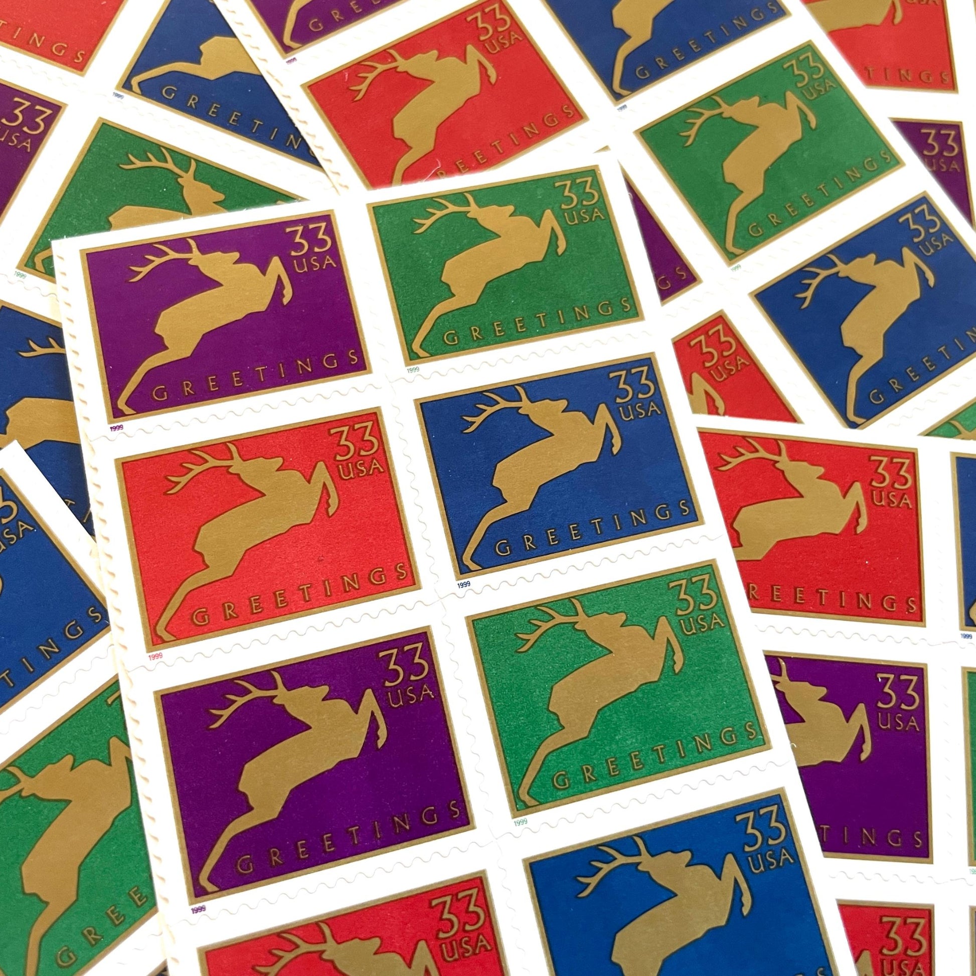 Image of 1999 Contemporary Christmas “Reindeer” 33-cent stamps. Scott #3360-63. Stamp Themes: Christmas, Holidays, Reindeer, Jumping Deer, Antlers, Greetings. Multicolored postage stamps.