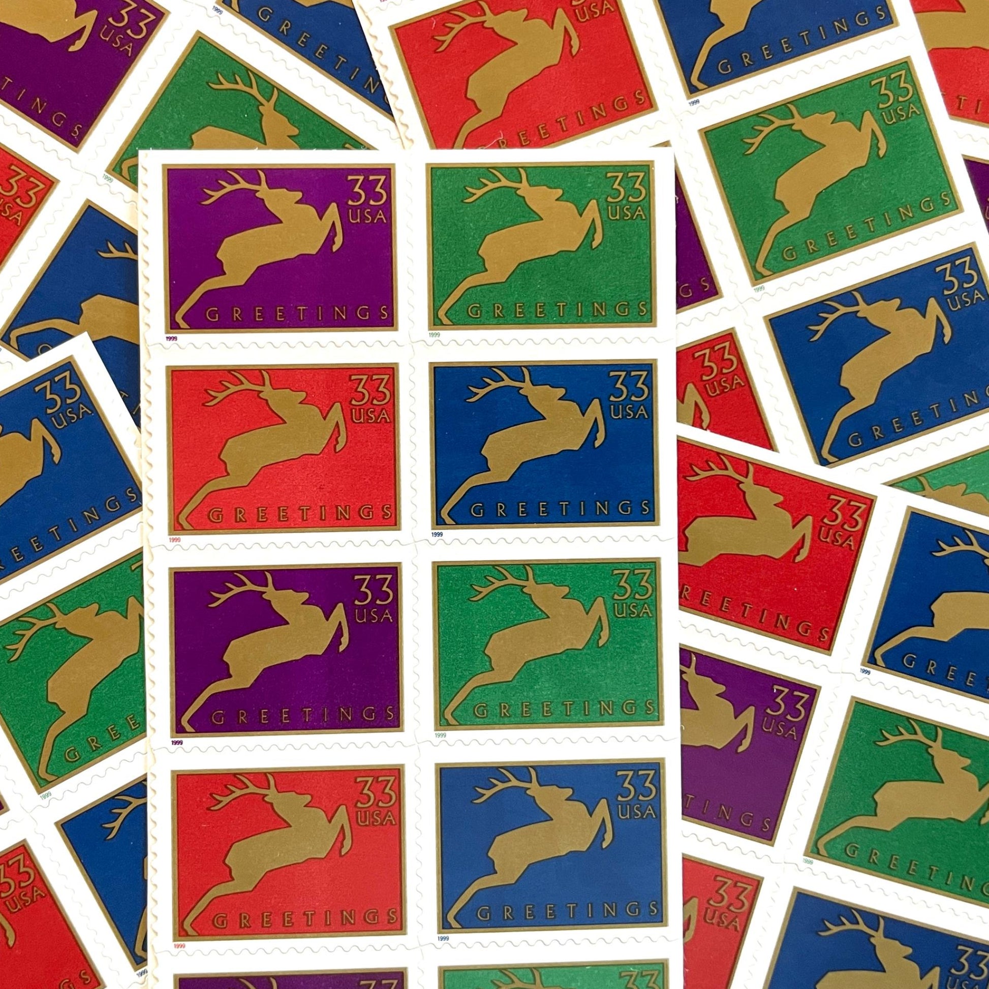 Image of 1999 Contemporary Christmas “Reindeer” 33-cent stamps. Scott #3360-63. Stamp Themes: Christmas, Holidays, Reindeer, Jumping Deer, Antlers, Greetings. Multicolored postage stamps.