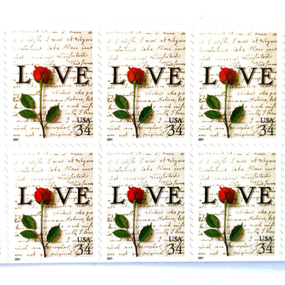 Rose & Love Letter postage stamps from 2001 featuring a red rose over John Adams’s handwritten love letter to Abigail Smith on vintage unused 34-cent USPS postage, Scott 3497.