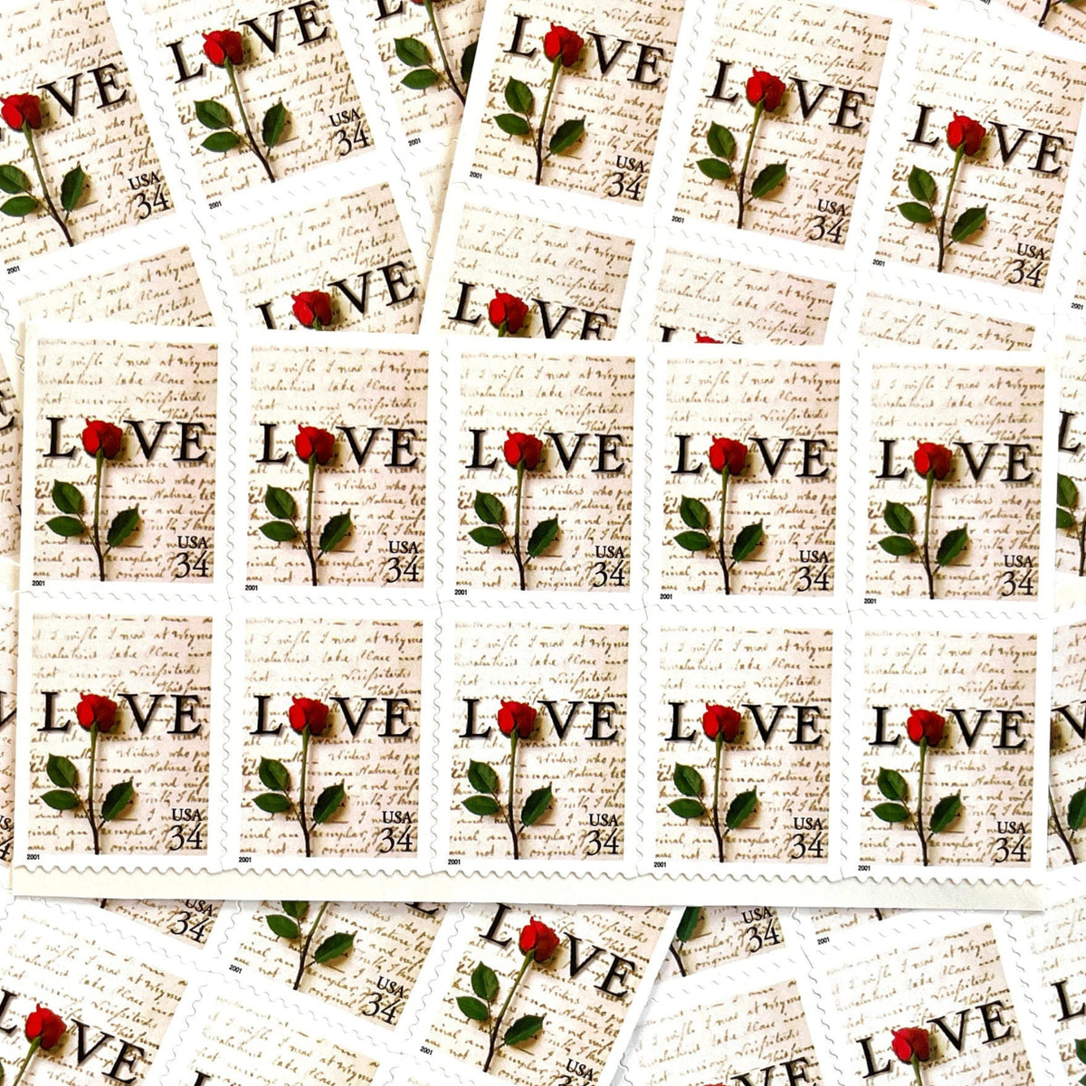 Rose & Love Letter postage stamps from 2001 featuring a red rose over John Adams’s handwritten love letter to Abigail Smith on vintage unused 34-cent USPS postage, Scott 3497.
