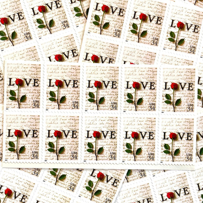 Rose & Love Letter postage stamps from 2001 featuring a red rose over John Adams’s handwritten love letter to Abigail Smith on vintage unused 34-cent USPS postage, Scott 3497.