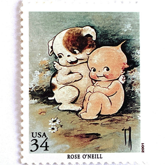 Vintage Rose O’Neill Kewpie postage stamp from the 2001 American Illustrators issue featuring Kewpie with Kewpiedoodle Dog on unused 34-cent USPS postage, Scott 3502i.