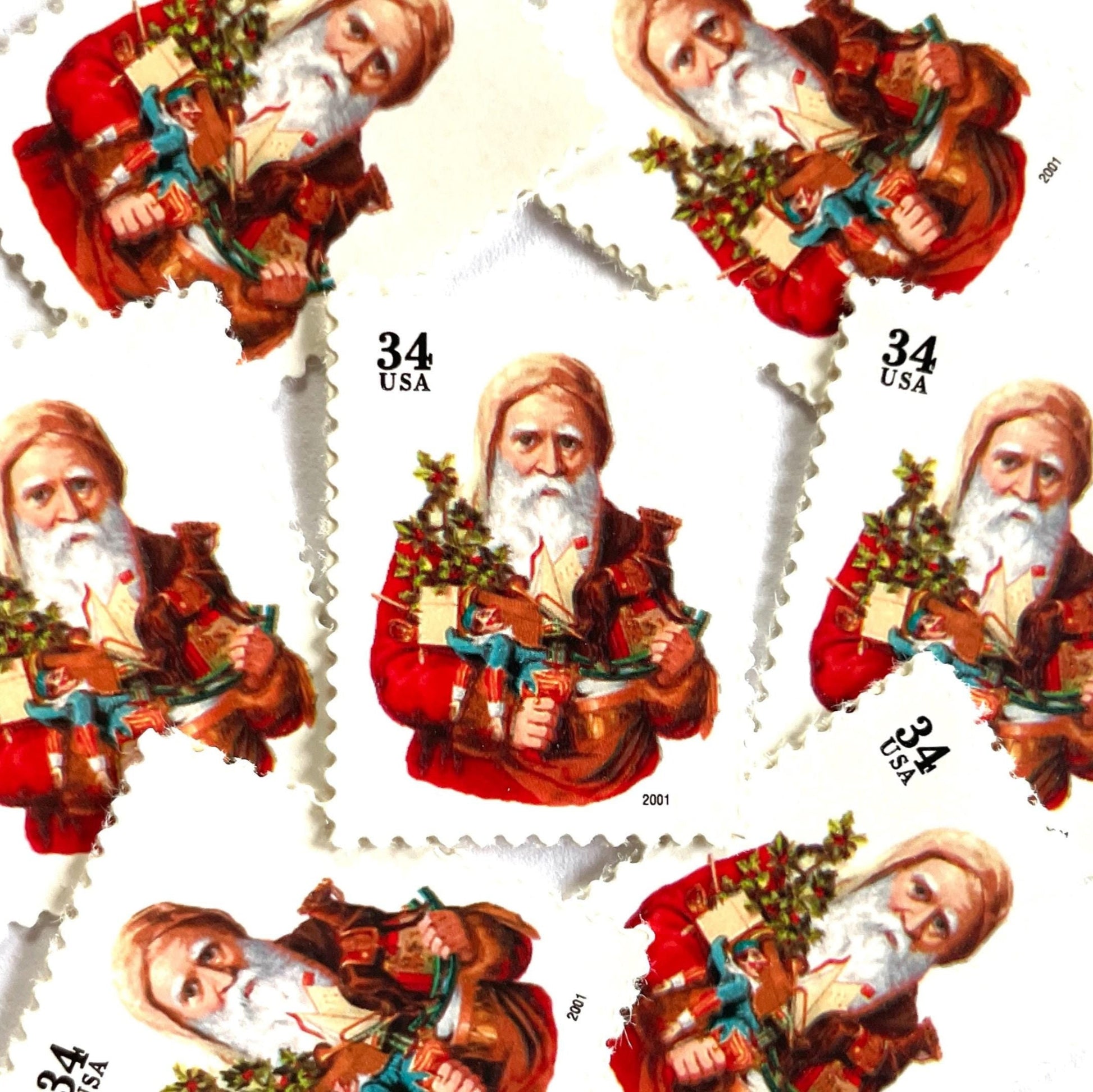 Image of 34-cent Contemporary Christmas Santa Claus Se-tenant “Santa with Toy Horse” USPS postage stamp featuring a relatively skinny white bearded Santa wearing a brown, hooded robe over a red suit. This sober looking Santa is holding a bounty of toys and gifts for children, including a doll dressed in blue and white, a small evergreen tree decorated with garland, and a rocking horse. Scott #3537. Stamp themes: Christmas, holidays, winter, Santa Claus, toys, gifts, winter wedding, winter save-the-date. Red