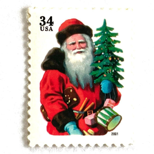Image of 34-cent Contemporary Christmas 2001 Santa Claus Se-tenant "Santa with Red Hat" and Christmas Tree USPS postage stamp featuring a portly and jovial Santa holding a Christmas tree, with a full white beard and a warm, inviting smile, gazing directly out from the stamp. He is wearing a red suit trimmed with brown fur, and a red cap. Scott #3539. Stamp themes: Christmas, holidays, winter, Santa Claus, toys, gifts, winter wedding, winter save-the-date. Red postage stamp.