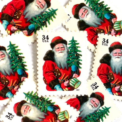 Image of 34-cent Contemporary Christmas 2001 Santa Claus Se-tenant "Santa with Red Hat" and Christmas Tree USPS postage stamp featuring a portly and jovial Santa holding a Christmas tree, with a full white beard and a warm, inviting smile, gazing directly out from the stamp. He is wearing a red suit trimmed with brown fur, and a red cap. Scott #3539. Stamp themes: Christmas, holidays, winter, Santa Claus, toys, gifts, winter wedding, winter save-the-date. Red postage stamp.