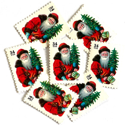 Image of 34-cent Contemporary Christmas 2001 Santa Claus Se-tenant "Santa with Red Hat" and Christmas Tree USPS postage stamp featuring a portly and jovial Santa holding a Christmas tree, with a full white beard and a warm, inviting smile, gazing directly out from the stamp. He is wearing a red suit trimmed with brown fur, and a red cap. Scott #3539. Stamp themes: Christmas, holidays, winter, Santa Claus, toys, gifts, winter wedding, winter save-the-date. Red postage stamp.