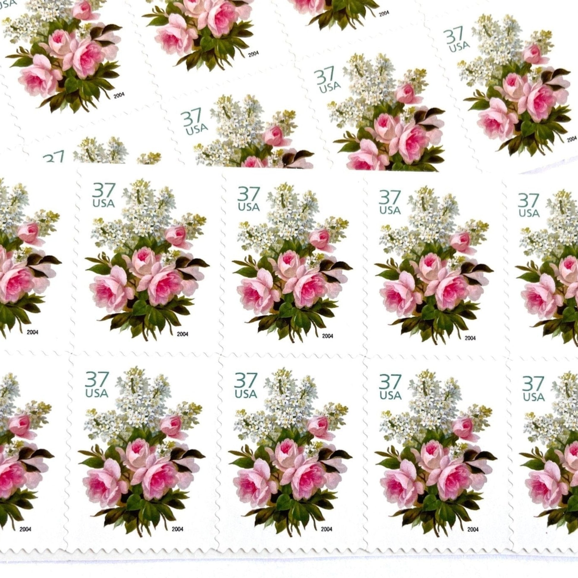 Image of 2004 Wedding Series “Garden Bouquet” unused 37-cent USPS mail stamps. Scott #3836. Stamp Themes: Flowers, Floral, Botanical, Bouquet, Wedding Bouquet, Bridal Flowers, Pastels, Victorian-era Botanical Art. Pink, White, Green, Multicolored postage stamp. Perfect postage stamp to use for save the date announcements, wedding invitation postage, shower invitations, thank you cards, valentine’s day, and snail mail.