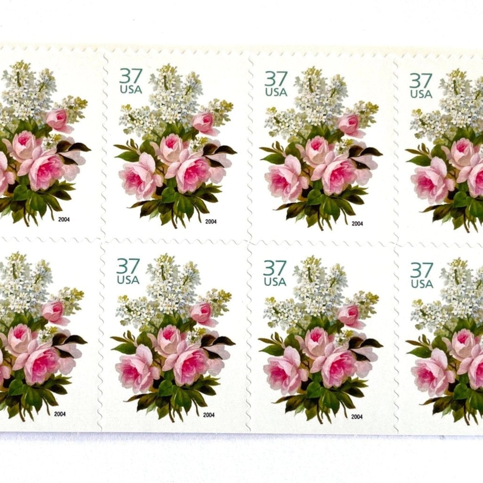 Image of 2004 Wedding Series “Garden Bouquet” unused 37-cent USPS mail stamps. Scott #3836. Stamp Themes: Flowers, Floral, Botanical, Bouquet, Wedding Bouquet, Bridal Flowers, Pastels, Victorian-era Botanical Art. Pink, White, Green, Multicolored postage stamp. Perfect postage stamp to use for save the date announcements, wedding invitation postage, shower invitations, thank you cards, valentine’s day, and snail mail.