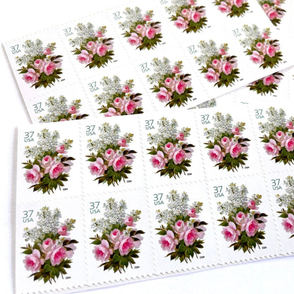 Image of 2004 Wedding Series “Garden Bouquet” unused 37-cent USPS mail stamps. Scott #3836. Stamp Themes: Flowers, Floral, Botanical, Bouquet, Wedding Bouquet, Bridal Flowers, Pastels, Victorian-era Botanical Art. Pink, White, Green, Multicolored postage stamp. Perfect postage stamp to use for save the date announcements, wedding invitation postage, shower invitations, thank you cards, valentine’s day, and snail mail.