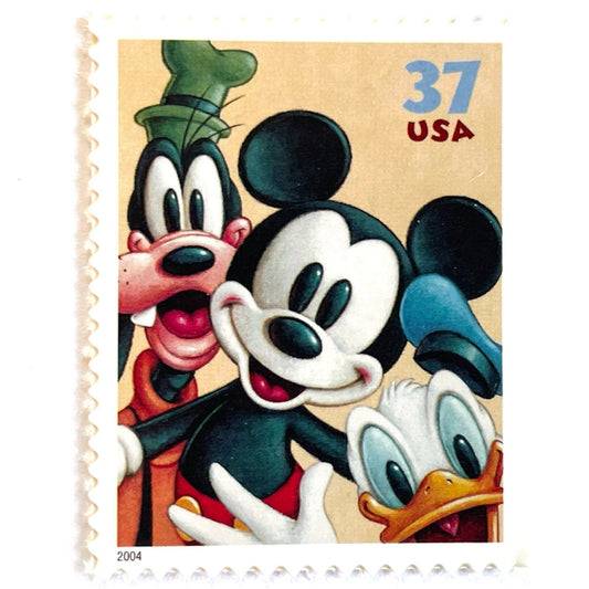 Mickey Mouse, Goofy and Donald Duck postage stamp from 2004 featuring the classic Disney friends on vintage unused 37-cent USPS postage, Scott 3865.