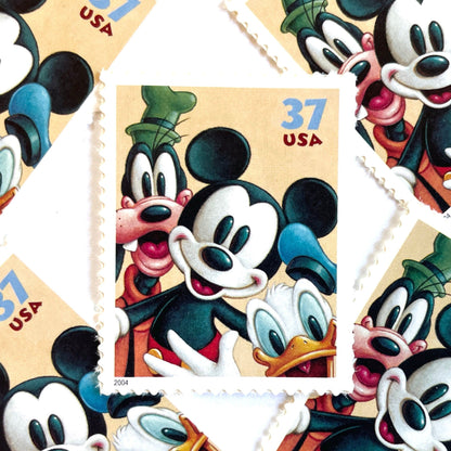 Mickey Mouse, Goofy and Donald Duck postage stamps from 2004 featuring the classic Disney friends on vintage unused 37-cent USPS postage, Scott 3865.