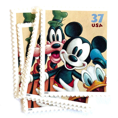 Mickey Mouse, Goofy and Donald Duck postage stamps from 2004 featuring the classic Disney friends on vintage unused 37-cent USPS postage, Scott 3865.