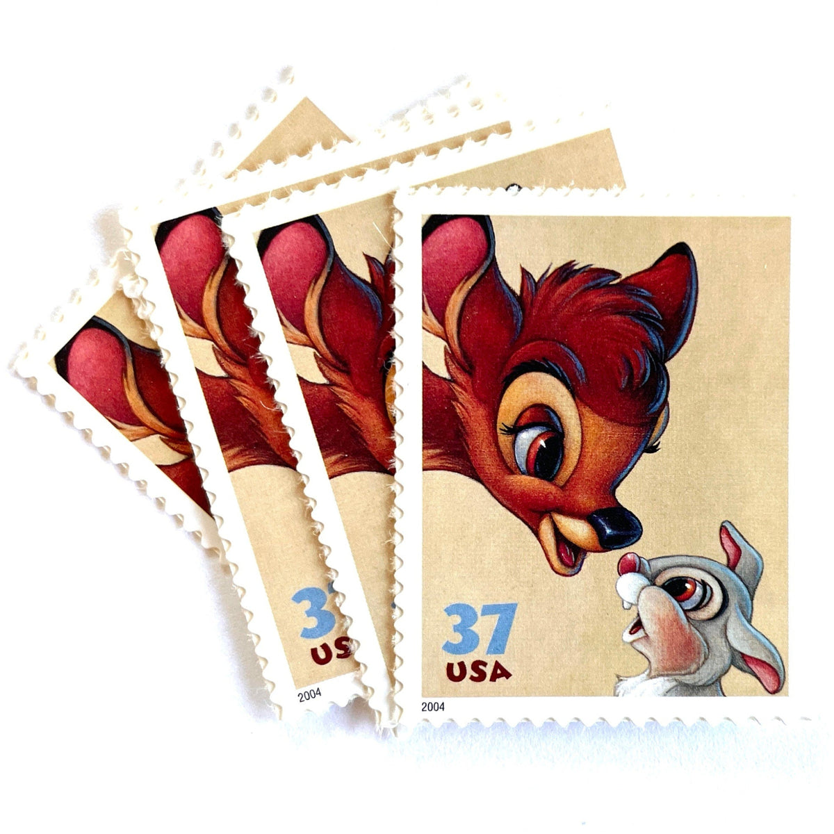 Bambi and Thumper postage stamps from 2004 featuring the beloved Disney woodland friends on vintage unused 37-cent USPS postage.