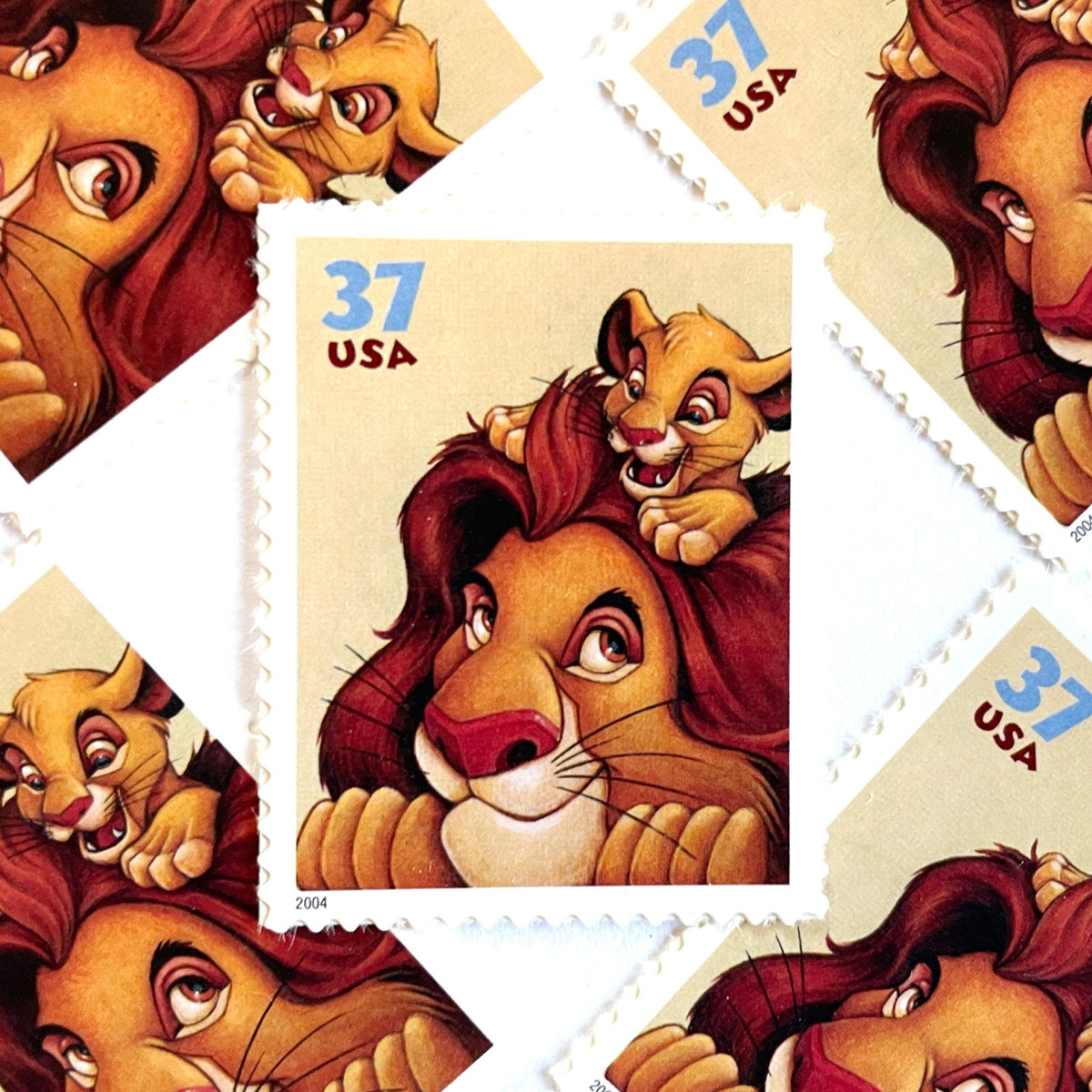 Mufasa and Simba postage stamps from 2004 featuring the father-and-son lions from The Lion King on vintage unused 37-cent USPS postage, Scott 3867.