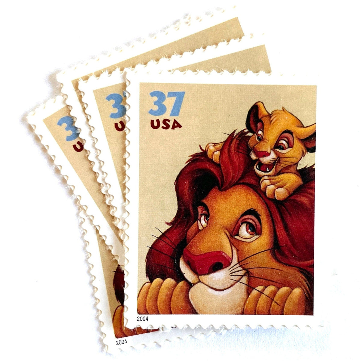 Mufasa and Simba postage stamps from 2004 featuring the father-and-son lions from The Lion King on vintage unused 37-cent USPS postage, Scott 3867.