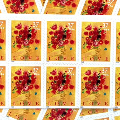 Love Bouquet postage stamps from 2005 featuring a hand offering colorful spring flowers against a yellow-gold background on vintage unused 37-cent USPS postage, Scott 3898.