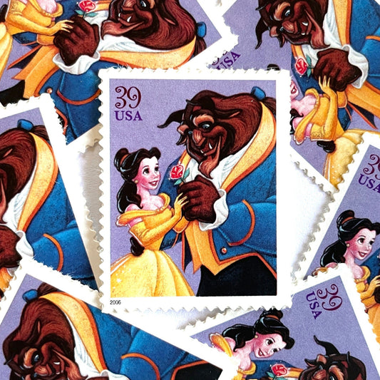 Beauty and the Beast postage stamps from 2006 featuring Belle and the Beast in a romantic Disney scene on vintage unused 39-cent USPS postage.