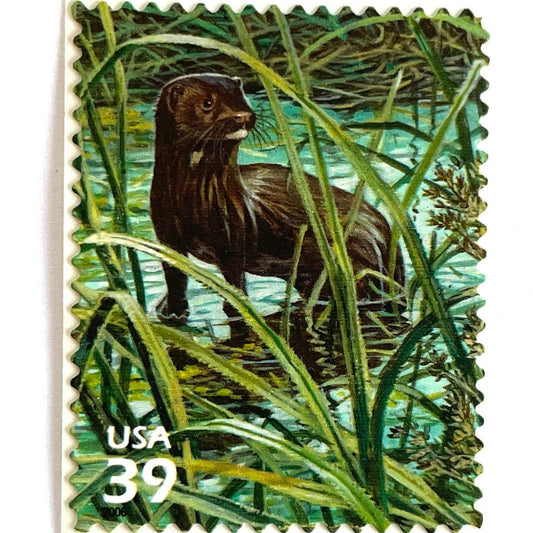 Vintage Everglades Mink postage stamp from the 2006 Southern Florida Wetland issue in the Nature of America series featuring a brown mink wading through marsh vegetation on unused 39-cent USPS postage, Scott 4099g.