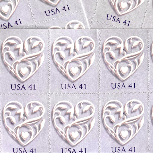 Image of 2007 Wedding Series “Purple Wedding Hearts” unused 41-cent USPS mail stamps. Scott #4151. Stamp Themes: Heart, Love, Wedding, Bridal. Purple, Lavender, Violet, White, Multicolored postage stamp. Perfect postage stamp to use for save the date announcements, wedding invitation postage, shower invitations, thank you cards, valentine’s day, and snail mail.