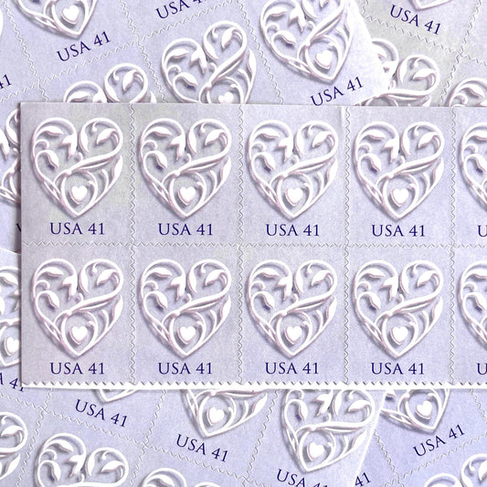 Vintage Purple Wedding Hearts postage stamps from the 2007 Hearts wedding issue featuring an ornate intertwined heart on a purple background on unused 41-cent USPS postage, Scott 4151.