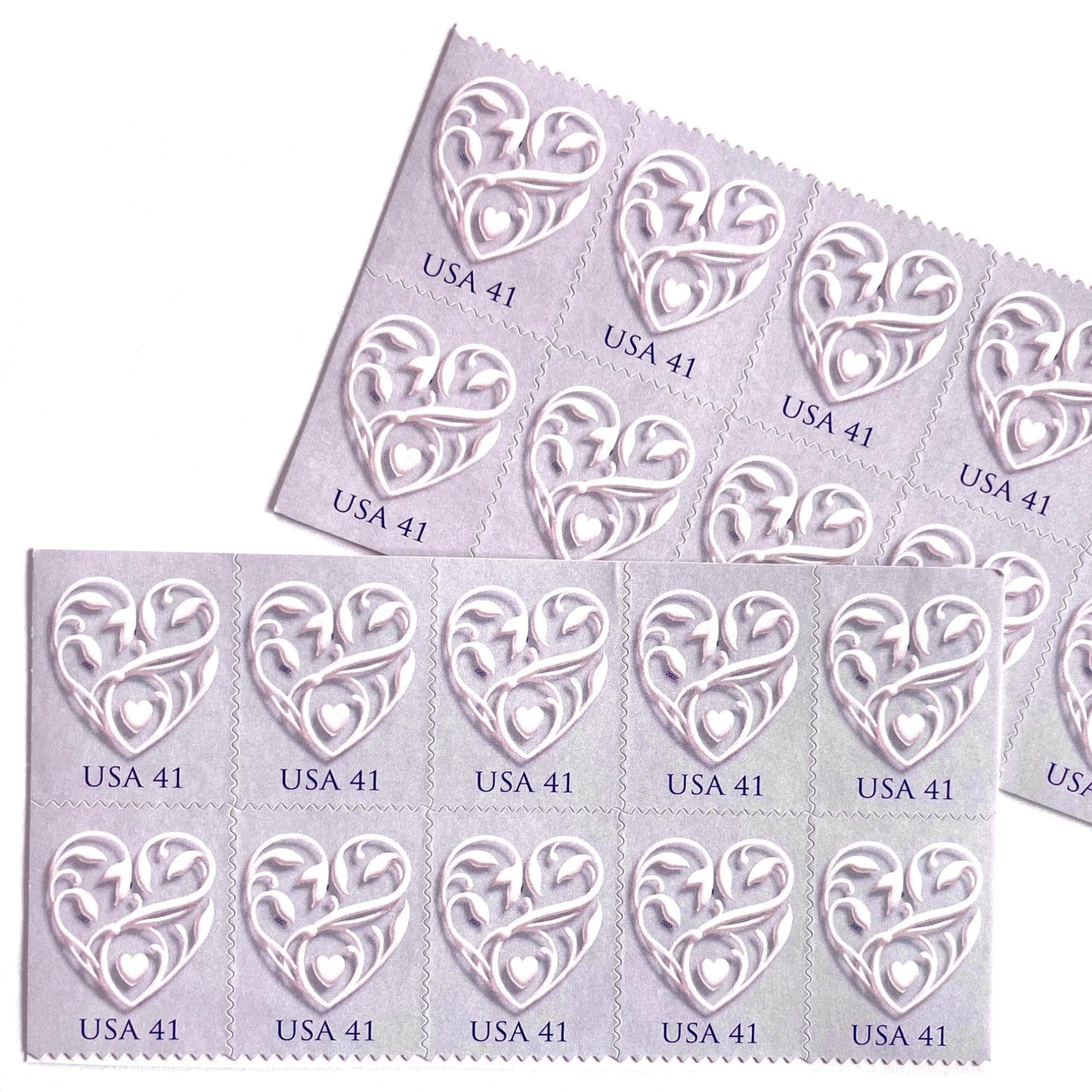 Image of 2007 Wedding Series “Purple Wedding Hearts” unused 41-cent USPS mail stamps. Scott #4151. Stamp Themes: Heart, Love, Wedding, Bridal. Purple, Lavender, Violet, White, Multicolored postage stamp. Perfect postage stamp to use for save the date announcements, wedding invitation postage, shower invitations, thank you cards, valentine’s day, and snail mail.