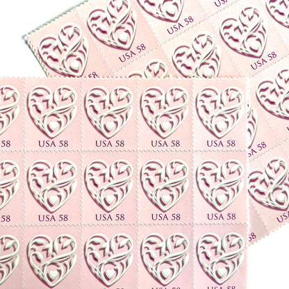 Image of 2007 Wedding Series “Pink Wedding Hearts” unused 58-cent USPS mail stamps. Scott #4152. Stamp Themes: Heart, Love, Wedding, Bridal. Pink, White, Multicolored postage stamp. Perfect postage stamp to use for save the date announcements, wedding invitation postage, shower invitations, thank you cards, valentine’s day, and snail mail.