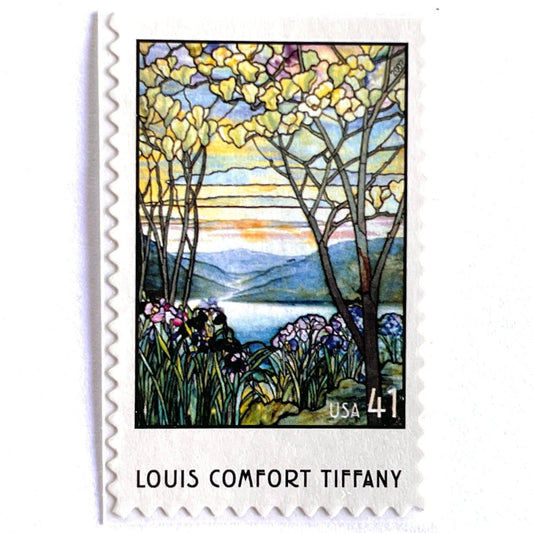 Image of 2007 American Treasures series “Louis Comfort Tiffany” (Magnolias and Irises in Stained Glass) unused 41-cent vintage USPS mail stamps. Scott #4165. Stamp Themes: Flowers, Floral, Botanical, Gardening, Nature, Tiffany Stained Glass. Purple, Blue, White, Multicolored self-adhesive postage stamp. Perfect postage stamp to use for save the date announcements, wedding invitation postage, bridal shower invitations, birth announcements, thank you cards, valentine’s day, and snail mail.