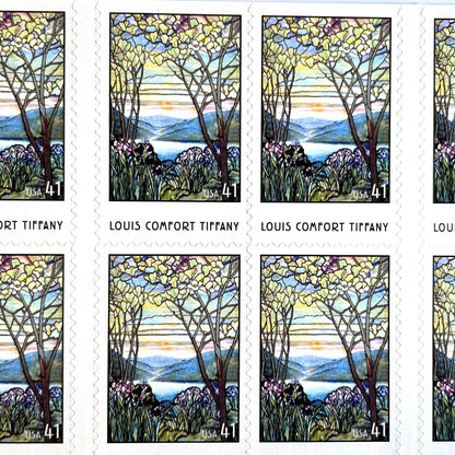 Image of 2007 American Treasures series “Louis Comfort Tiffany” (Magnolias and Irises in Stained Glass) unused 41-cent vintage USPS mail stamps. Scott #4165. Stamp Themes: Flowers, Floral, Botanical, Gardening, Nature, Tiffany Stained Glass. Purple, Blue, White, Multicolored self-adhesive postage stamp. Perfect postage stamp to use for save the date announcements, wedding invitation postage, bridal shower invitations, birth announcements, thank you cards, valentine’s day, and snail mail.