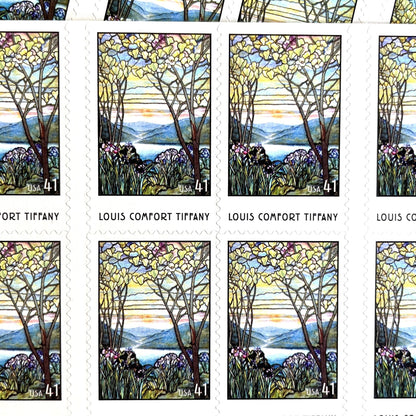 Image of 2007 American Treasures series “Louis Comfort Tiffany” (Magnolias and Irises in Stained Glass) unused 41-cent vintage USPS mail stamps. Scott #4165. Stamp Themes: Flowers, Floral, Botanical, Gardening, Nature, Tiffany Stained Glass. Purple, Blue, White, Multicolored self-adhesive postage stamp. Perfect postage stamp to use for save the date announcements, wedding invitation postage, bridal shower invitations, birth announcements, thank you cards, valentine’s day, and snail mail.