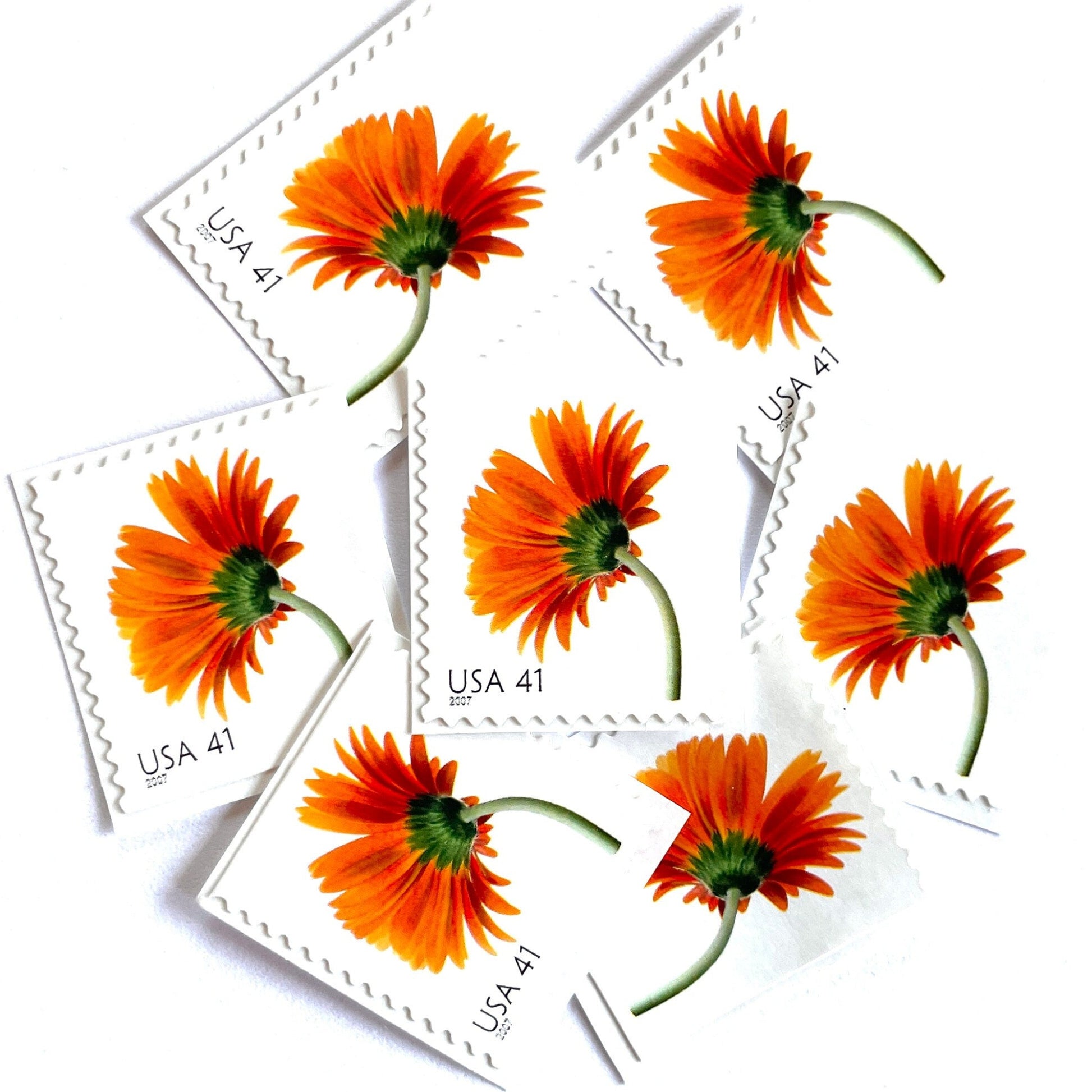 Image of 2007 Beautiful Blooms series “Orange Gerbera Daisy” unused 41-cent vintage USPS mail stamps. Scott #4177. Stamp Themes: Flowers, Floral, Botanical, Fragrant, Gardening, Nature. Orange, Green, Multicolored self-adhesive postage stamp. Perfect postage stamp to use for save the date announcements, wedding invitation postage, bridal shower invitations, birth announcements, thank you cards, valentine’s day, and snail mail.