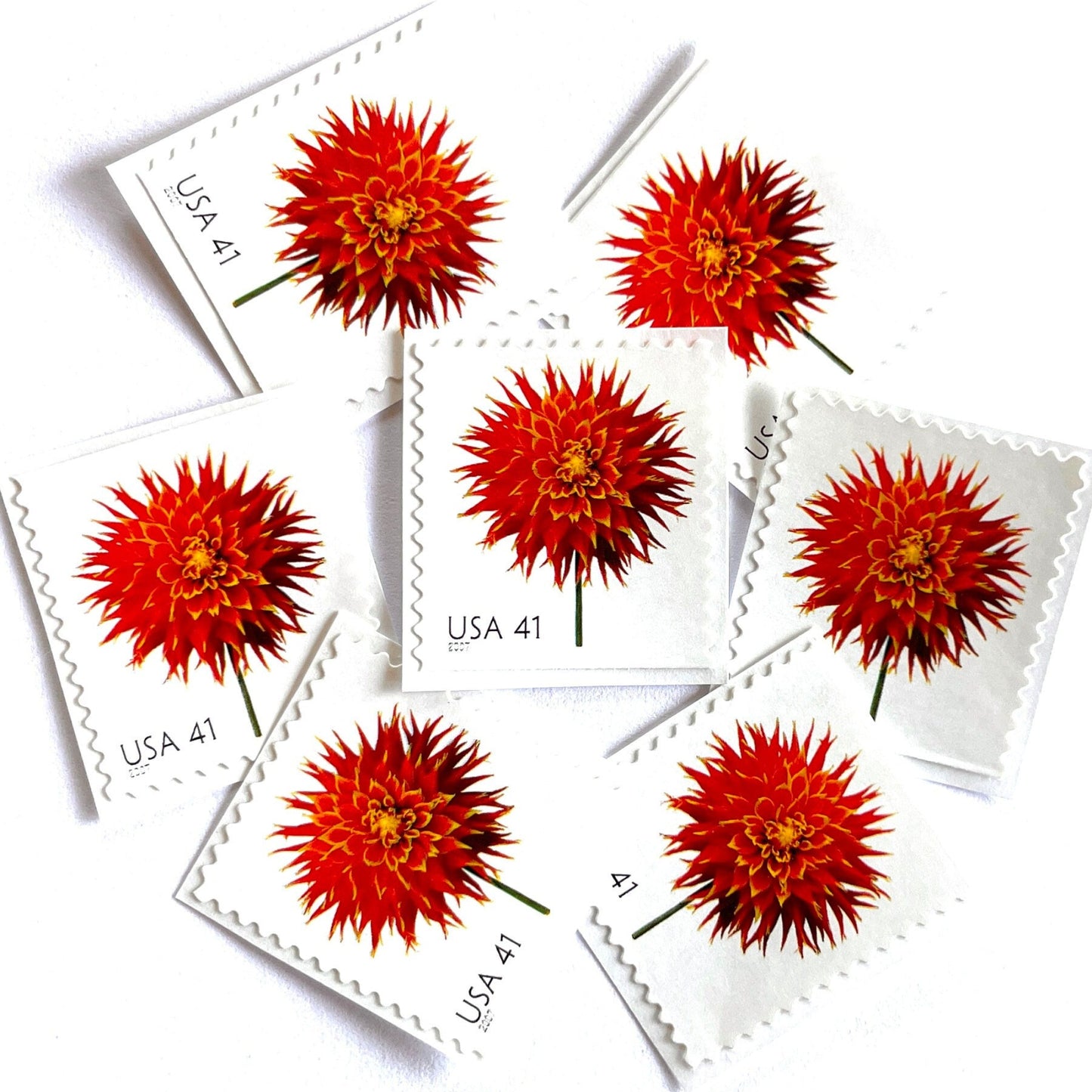 Image of 2007 Beautiful Blooms series “Dahlia” unused 41-cent vintage USPS mail stamps. Scott #4179. Stamp Themes: Flowers, Floral, Botanical, Fragrant, Gardening, Nature. Red, Green, Multicolored self-adhesive postage stamp. Perfect postage stamp to use for save the date announcements, wedding invitation postage, bridal shower invitations, birth announcements, thank you cards, valentine’s day, and snail mail.