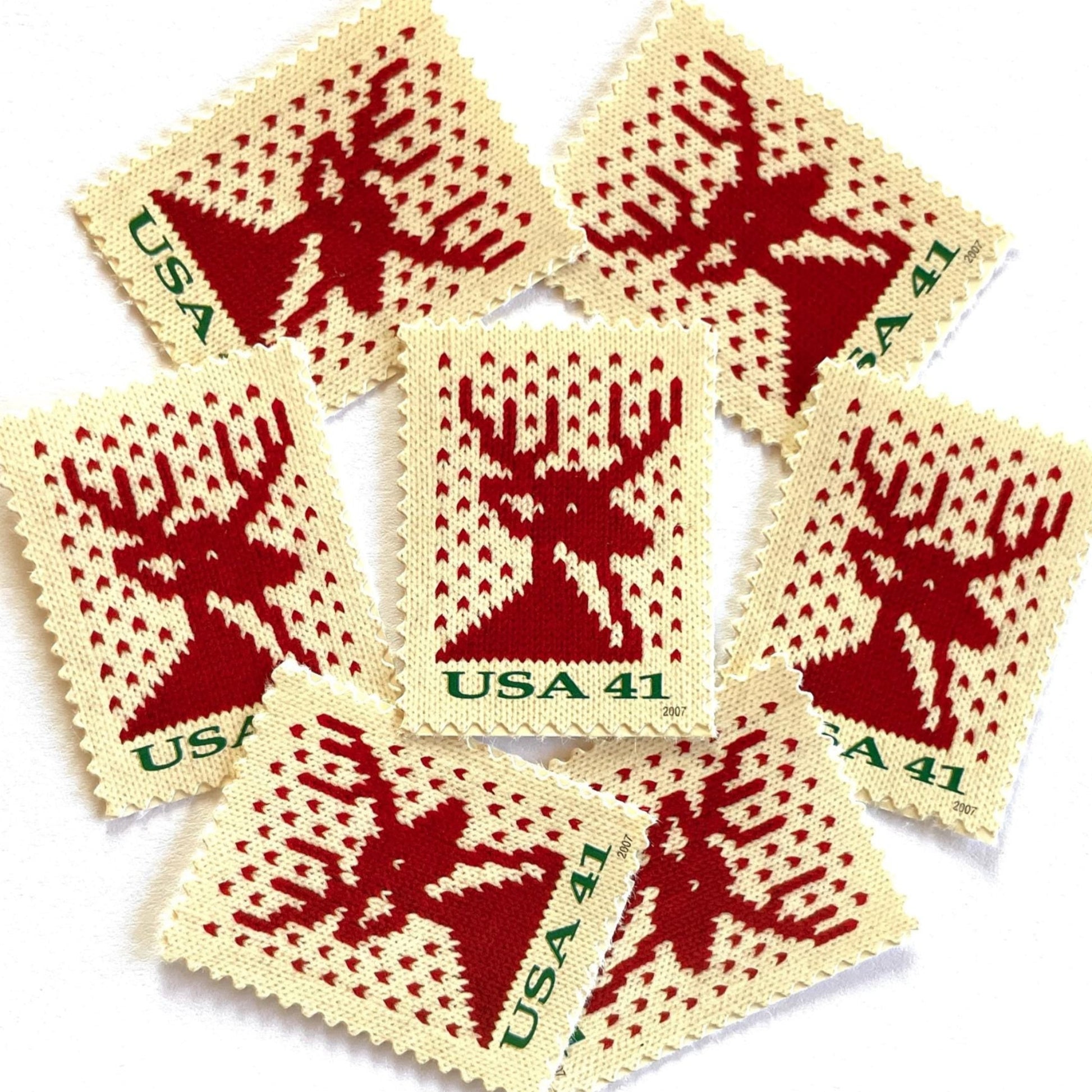 Image of 41-cent Contemporary Christmas Holiday Knits Reindeer USPS postage stamp featuring a red/orange knit reindeer on white background. Scott #4207. Themes: Christmas, Holidays, Winter, Reindeer, Deer, Stag, Stud, reindeer, deer, stag, orange, hunting, hunter, deer hunting, stag party, bachelor party, bachelor, stud, Red and White Stamp.