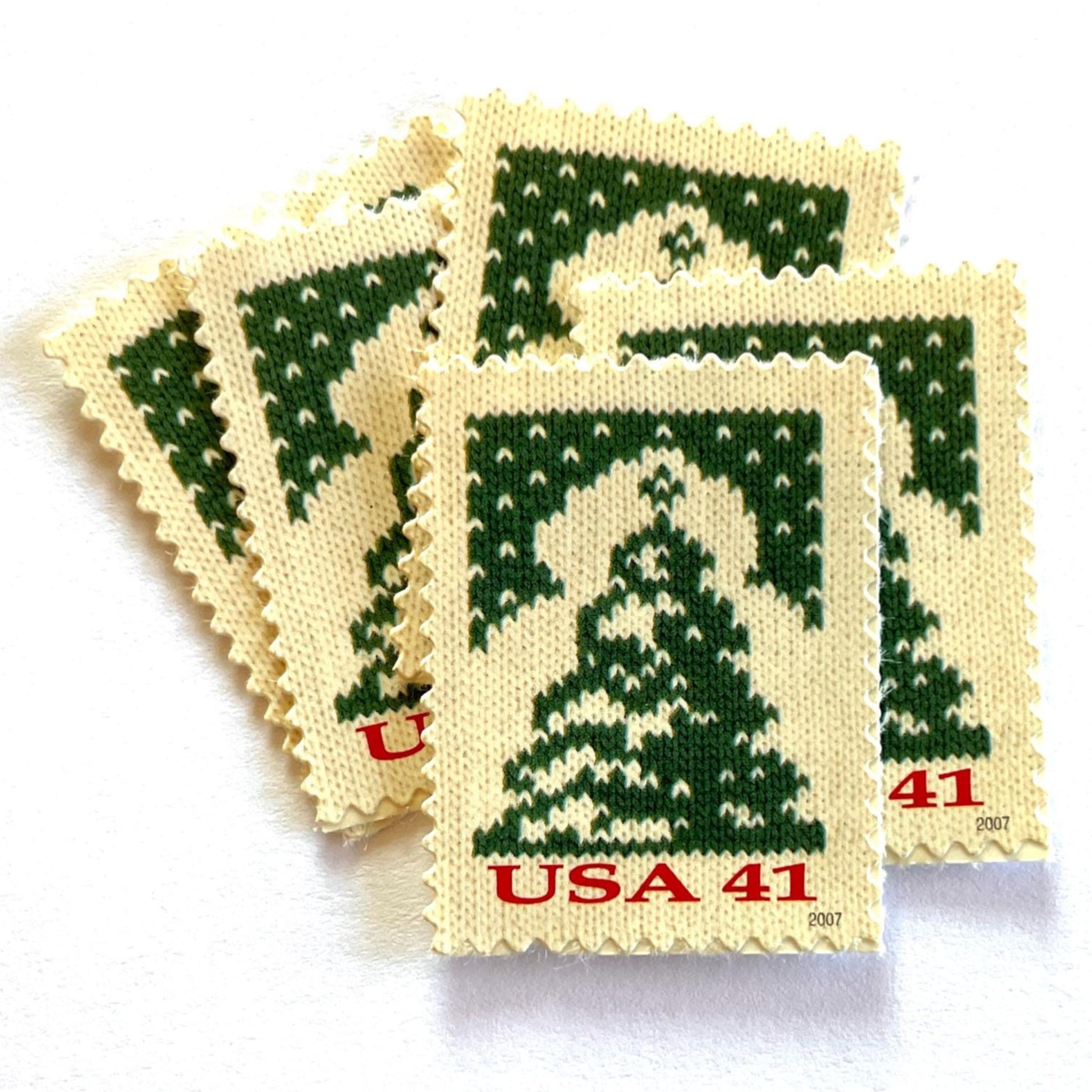 Image of 41-cent Contemporary Christmas Holiday Knits Christmas Tree USPS postage stamps featuring a green tree on white background. Scott #4208. Themes: Christmas, Holidays, Winter, Christmas Tree, Conifer, Evergreen, Green and White Stamp.