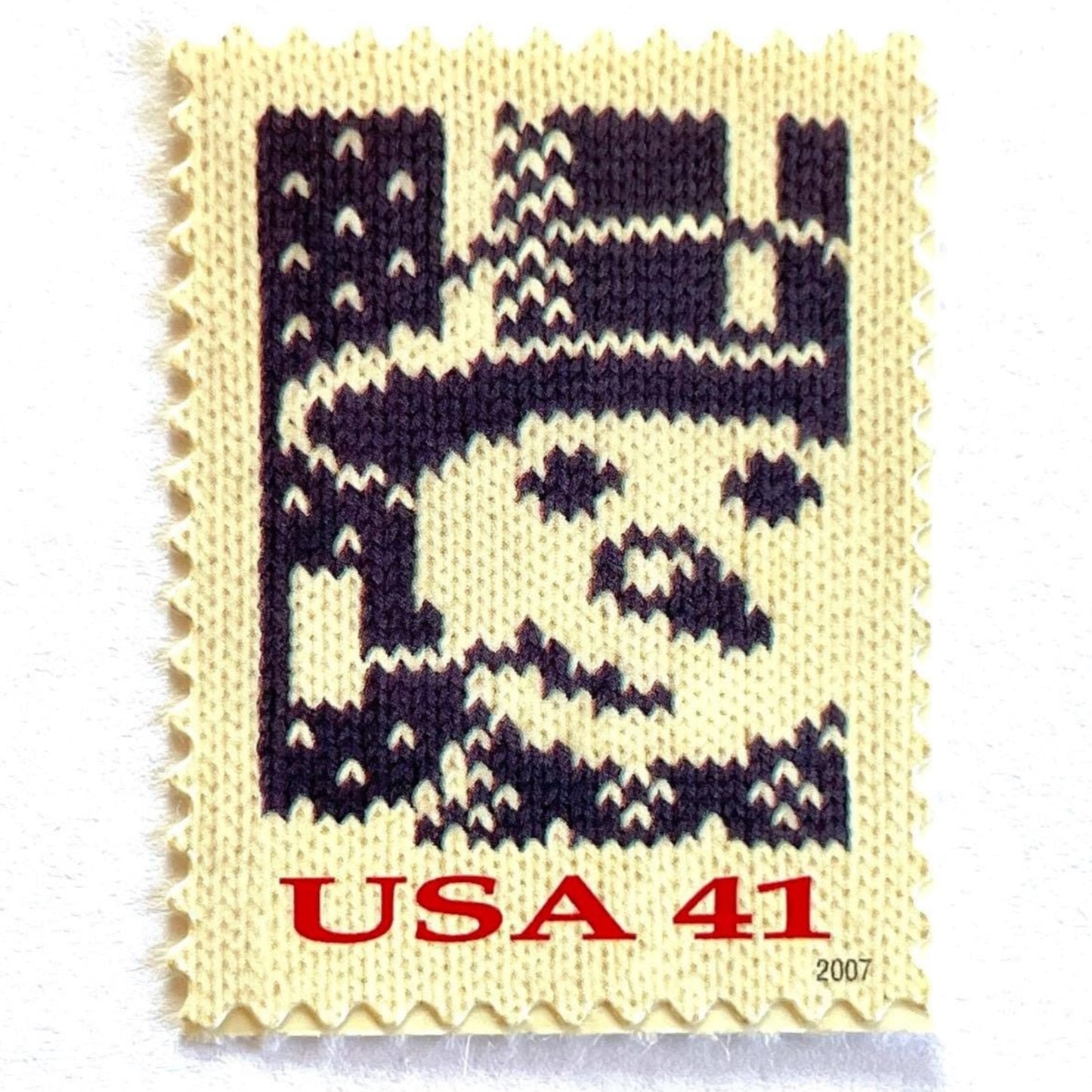 Image of 41-cent Contemporary Christmas Holiday Knits Snowman USPS postage stamp featuring a blue snowman on white background. Scott #4209. Themes: Christmas, Hanukkah, Holidays, Winter, Snow, Snowman, Frosty the Snowman, Blue Stamp.