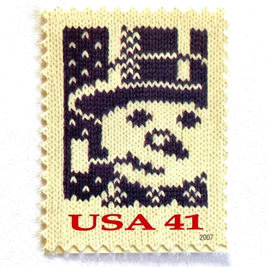 Image of 41-cent Contemporary Christmas Holiday Knits Snowman USPS postage stamp featuring a blue snowman on white background. Scott #4209. Themes: Christmas, Hanukkah, Holidays, Winter, Snow, Snowman, Frosty the Snowman, Blue Stamp.