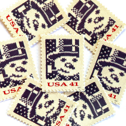 Image of 41-cent Contemporary Christmas Holiday Knits Snowman USPS postage stamp featuring a blue snowman on white background. Scott #4209. Themes: Christmas, Hanukkah, Holidays, Winter, Snow, Snowman, Frosty the Snowman, Blue Stamp.