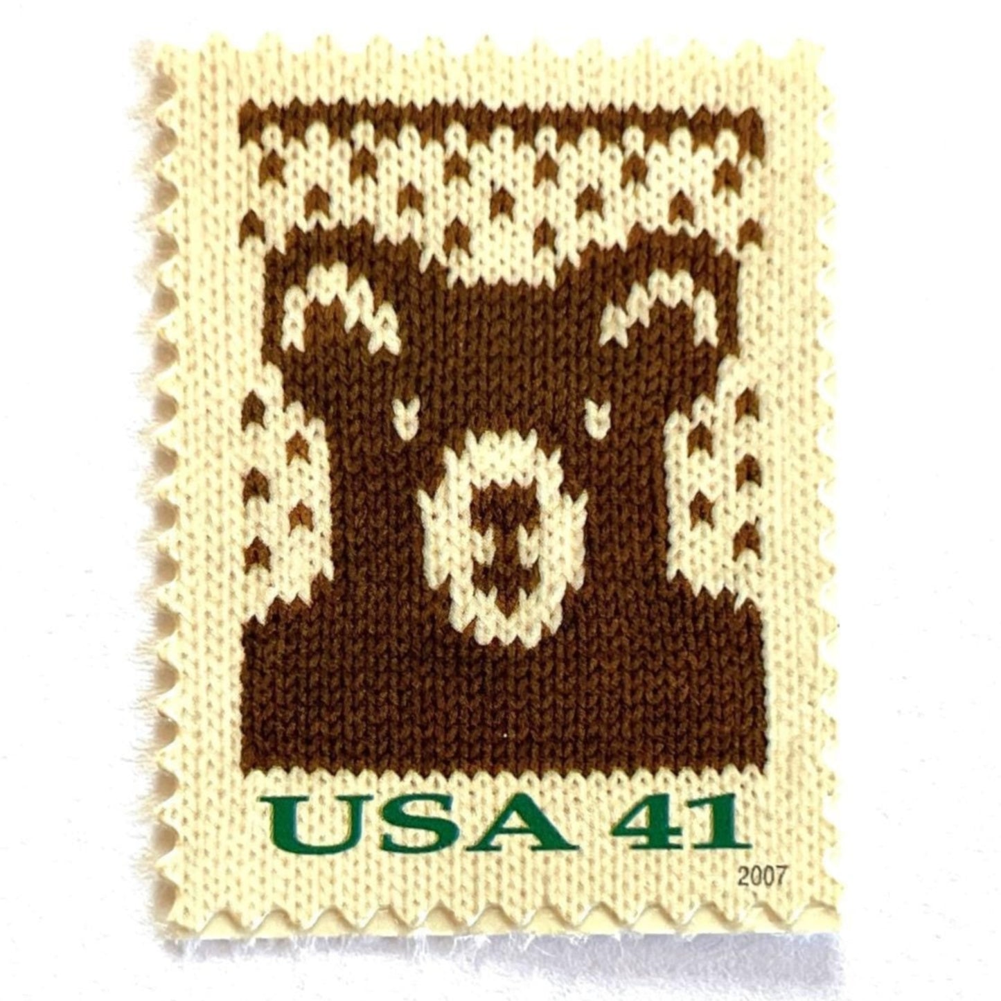 Image of 41-cent Contemporary Christmas Holiday Knits Bear USPS postage stamp featuring a brown knit teddy bear on white background. Scott #4210. Themes: Christmas, Holidays, Winter, Bear, Teddy Bear, Brown and White Stamp.