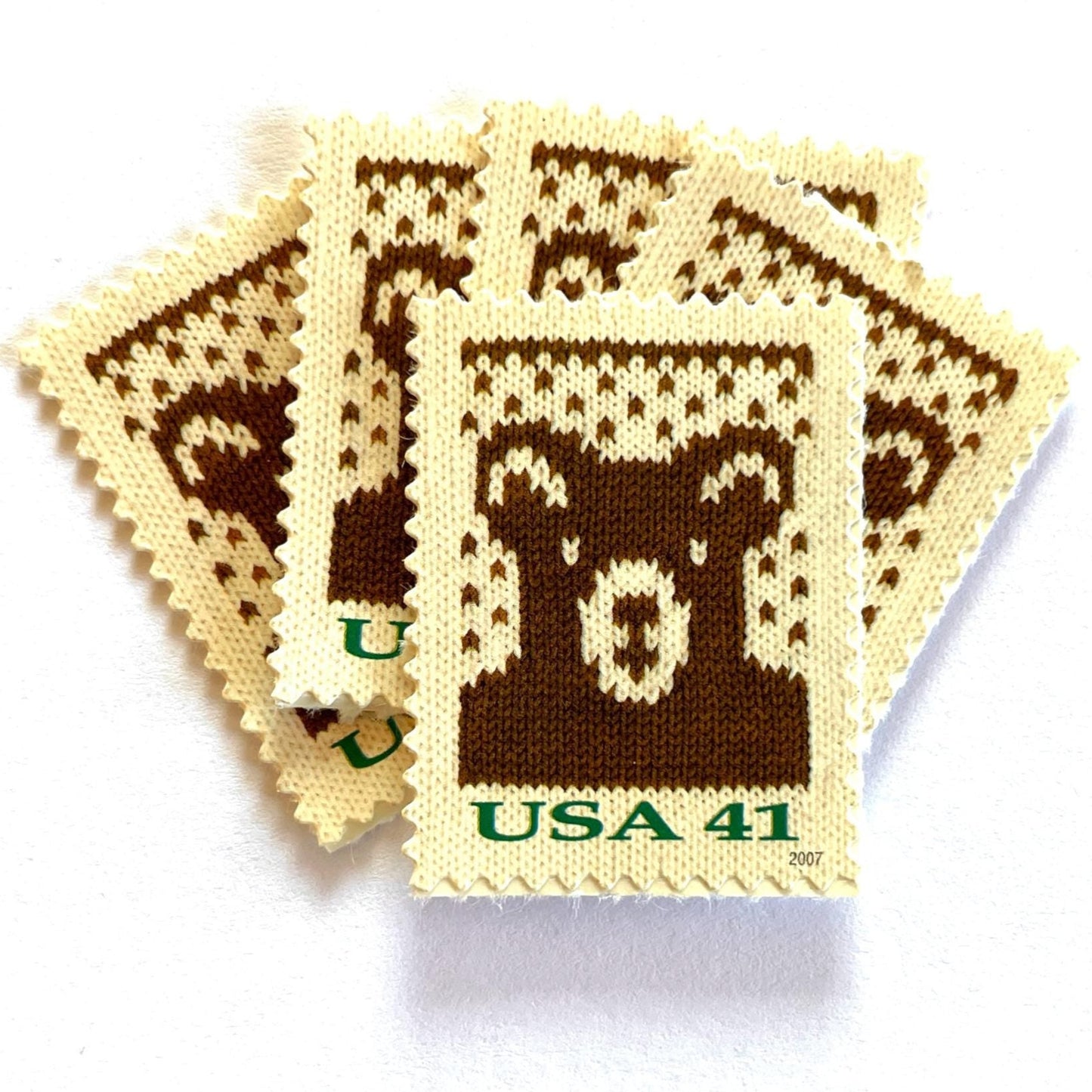 Image of 41-cent Contemporary Christmas Holiday Knits Bear USPS postage stamps featuring a brown knit teddy bear on white background. Scott #4210. Themes: Christmas, Holidays, Winter, Bear, Teddy Bear, Brown and White Stamp.