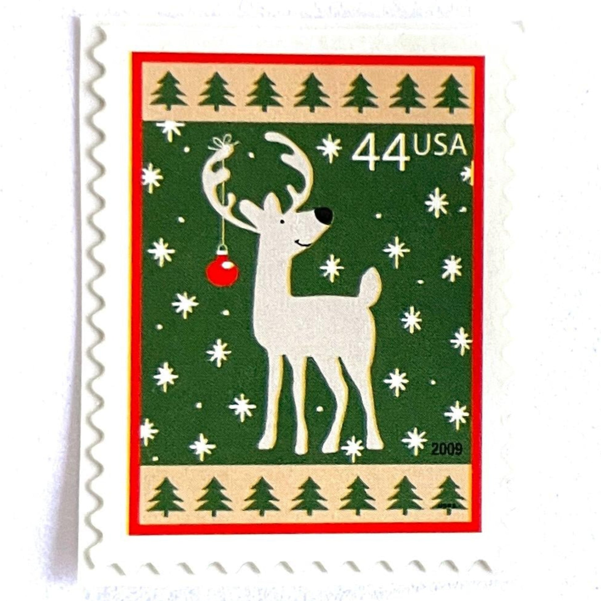 Image of 44-cent Contemporary Christmas Winter Holidays Reindeer USPS postage stamp featuring a reindeer on green and white background with a design reminiscent of Christmas wrapping paper. Scott #4425. Stamp themes: Christmas, holidays, winter, reindeer, deer, stag, reindeer, winter wedding, winter save-the-date. Green postage stamp.