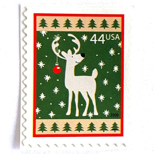 Image of 44-cent Contemporary Christmas Winter Holidays Reindeer USPS postage stamp featuring a reindeer on green and white background with a design reminiscent of Christmas wrapping paper. Scott #4425. Stamp themes: Christmas, holidays, winter, reindeer, deer, stag, reindeer, winter wedding, winter save-the-date. Green postage stamp.