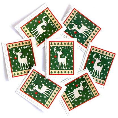 Image of 44-cent Contemporary Christmas Winter Holidays Reindeer USPS postage stamp featuring a reindeer on green and white background with a design reminiscent of Christmas wrapping paper. Scott #4425. Stamp themes: Christmas, holidays, winter, reindeer, deer, stag, reindeer, winter wedding, winter save-the-date. Green postage stamp.