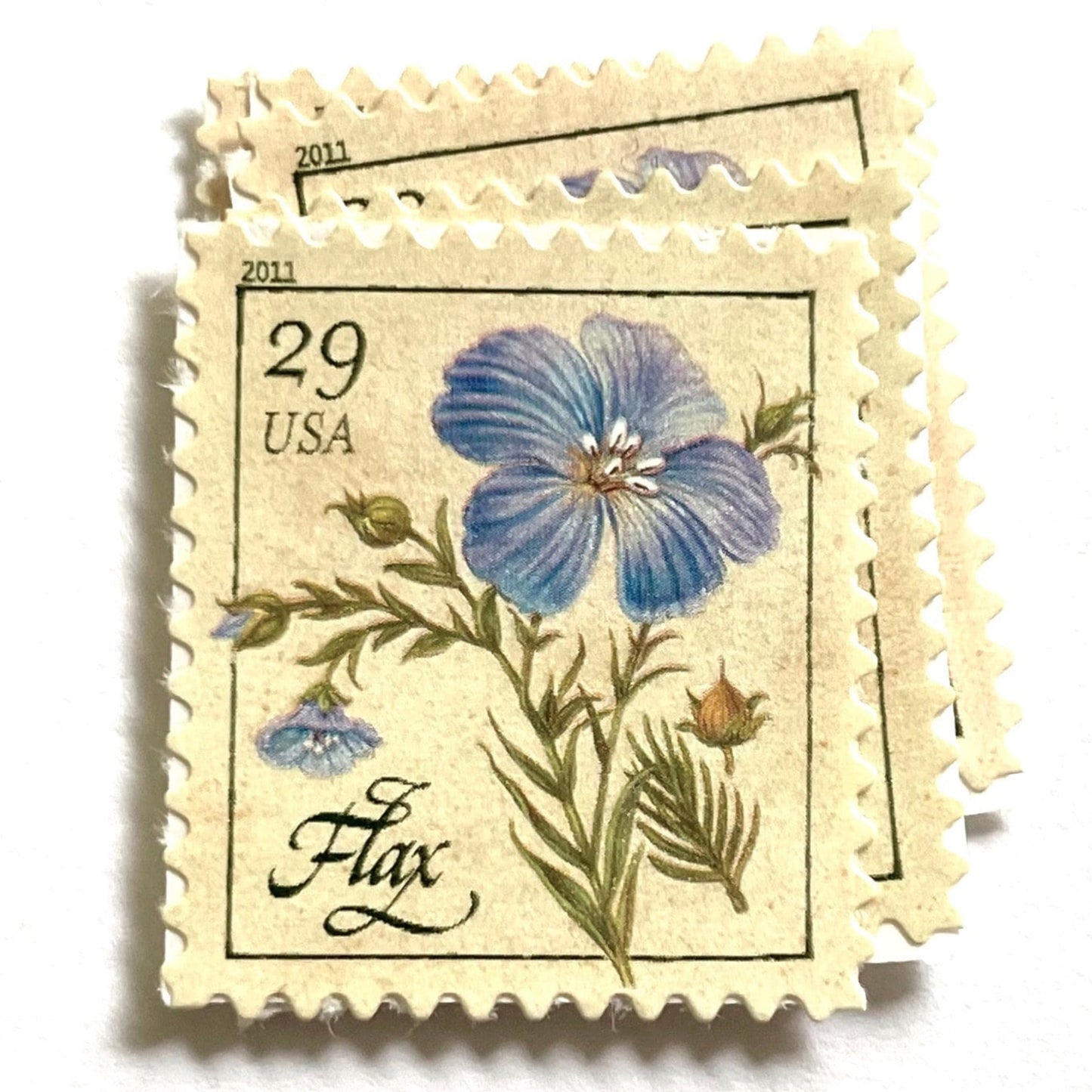 Image of 2011 Herbs Series “Flax” unused 29-cent USPS mail stamps. Scott #4506. Stamp Themes: Herbs, Medicinal, Culinary, Cooking, Flowers, Wildflowers, Floral, Botanical, Fragrant, Mediterranean. Blue, Green, Beige/Neutral, Multicolored self-adhesive postage stamp. Perfect postage stamp to use for save the date announcements, wedding invitation postage, shower invitations, birth announcements, thank you cards, valentine’s day, and snail mail.