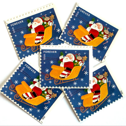 Santa Flying in Sleigh postage stamps from 2012 featuring St. Nick traveling through a wintry Christmas Eve sky in his sleigh on unused USPS Forever postage, Scott 4713.