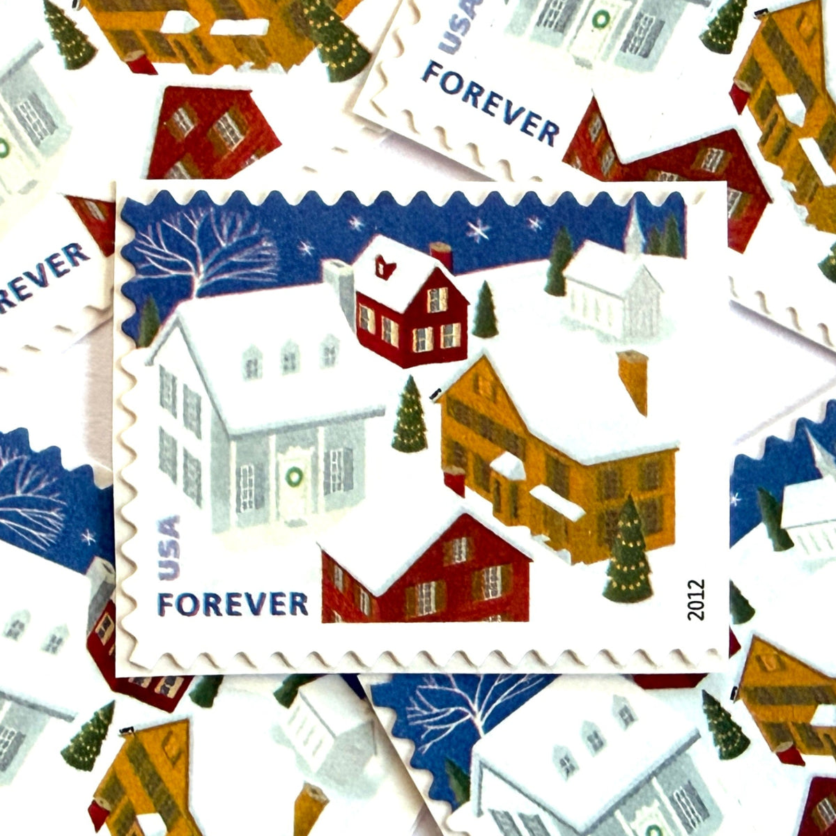Snow-Covered Roofs postage stamps from 2012 featuring a quiet snowy neighborhood beneath a dark Christmas Eve sky on unused USPS Forever postage, Scott 4715.