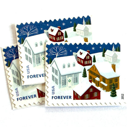 Snow-Covered Roofs postage stamps from 2012 featuring a quiet snowy neighborhood beneath a dark Christmas Eve sky on unused USPS Forever postage, Scott 4715.
