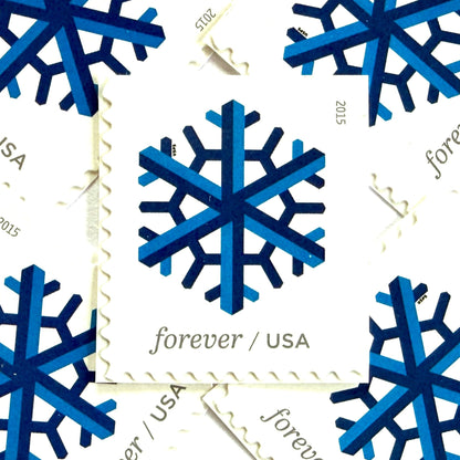 Dark blue and blue Geometric Snowflake postage stamps from 2015 featuring a stylized crystalline winter design on unused USPS Forever postage, Scott 5032.