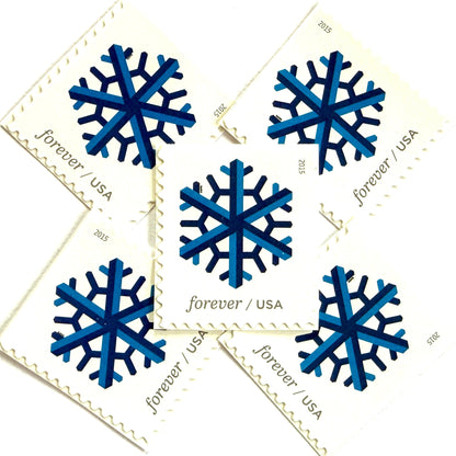 Dark blue and blue Geometric Snowflake postage stamps from 2015 featuring a stylized crystalline winter design on unused USPS Forever postage, Scott 5032.